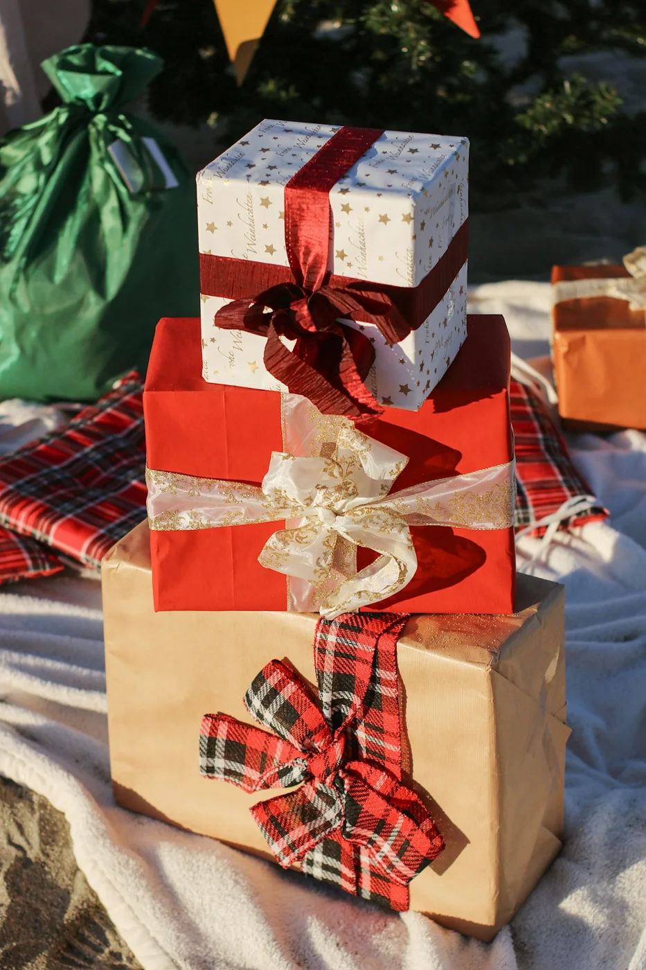 Wrapped gifts arranged on a soft blanket