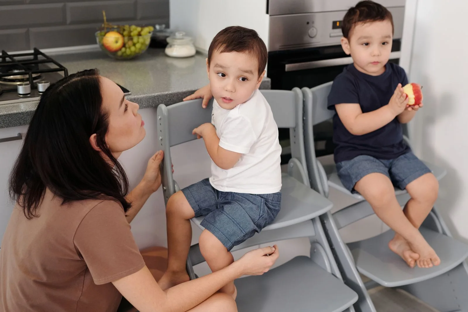 Mother and children spending time in a kitchen