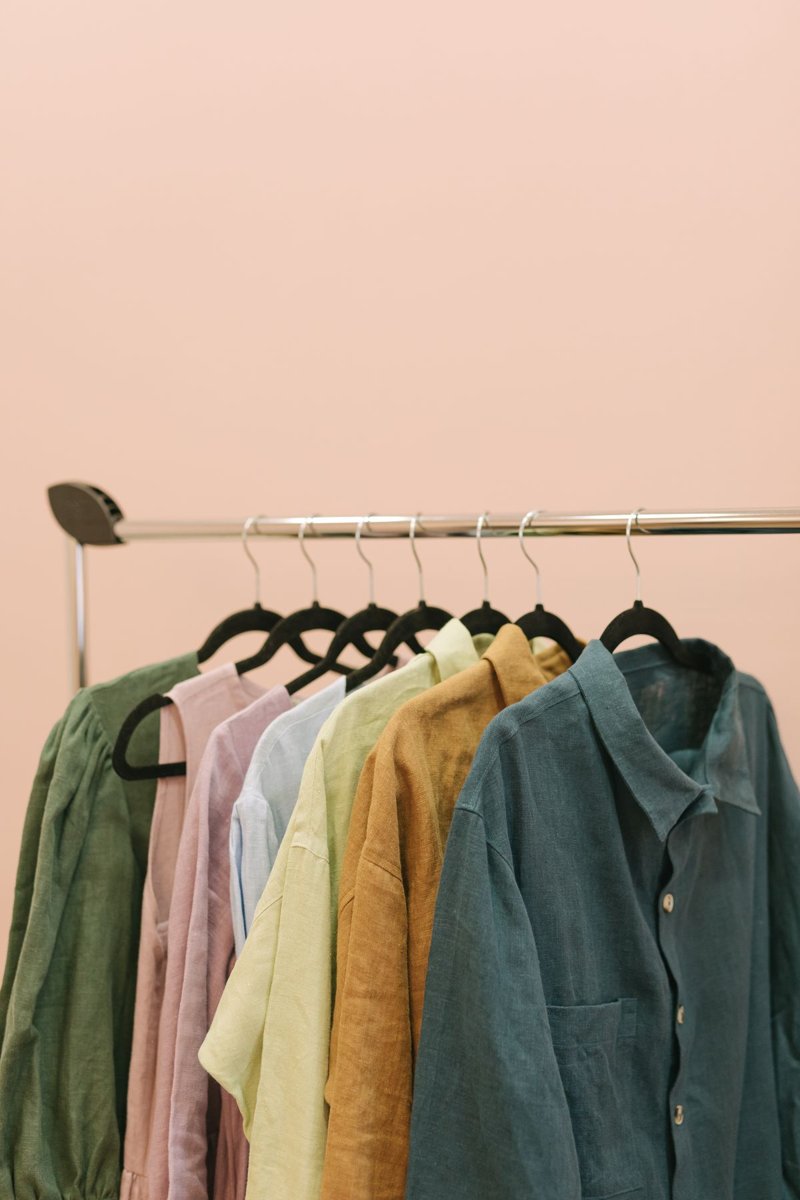 Shirts in several colors hanging on a clothes rail